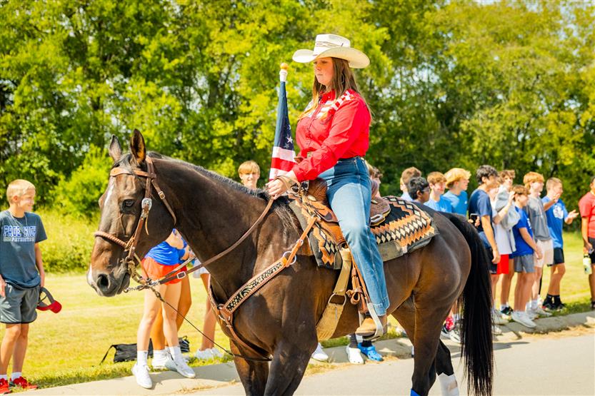A student rides a horse